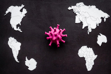 Corona virus Covid-19 - epidemic concept with world map - on black background top-down