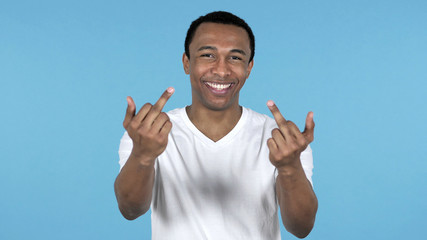 Happy African Man Showing Middle Fingers Isolated on Blue Background