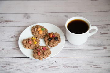 Cup coffee with cookies on wooden table,Breakfast