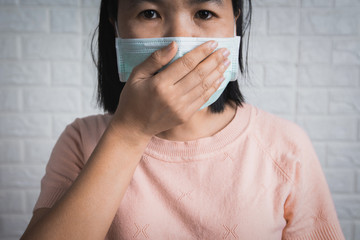 Asia China or Thai woman wearing face mask to protect corona virus