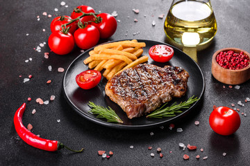 Ribeye steak with potatoes, onions and cherry tomatoes