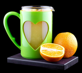 Hot tea with oranges and lemon on a black background