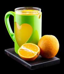 Hot tea with oranges and lemon on a black background