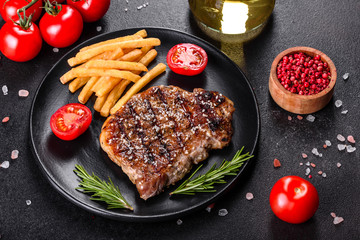 Ribeye steak with potatoes, onions and cherry tomatoes