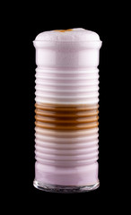 Hot coffee drink on a black background. Latte with milk and colorful additives