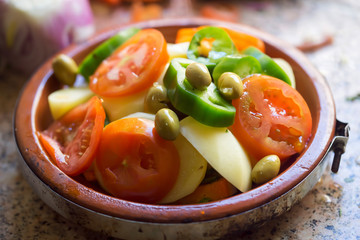 Potato, green pepper, tomato, olives vegetable tajine, Morocco