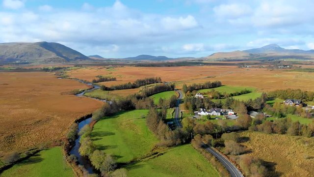 River and road in desert fields of Connemara National Park