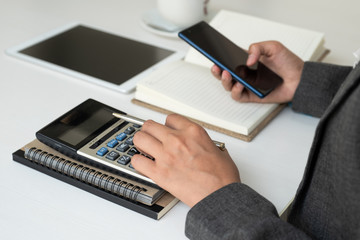 Business woman use  calculator set targets for new business management success.