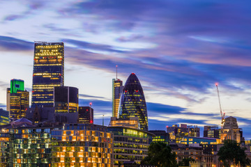 London cityscape financial district against a dramatic sunset sky