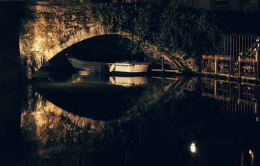 Boat under a bridge in Bruges