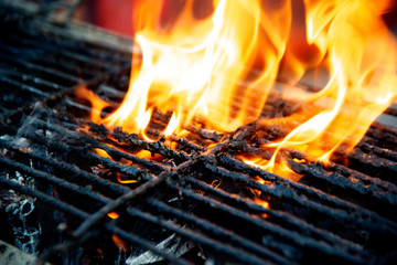 Steel grate for grilling food on charcoal that is combustible and hot.