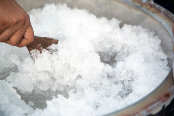 The finely ground ice is mixed in an old-fashioned Thai ice-cream tank.