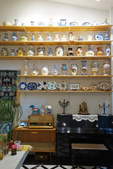 Interior decoration and design of restaurant and cafe decorated with antique porcelain containers