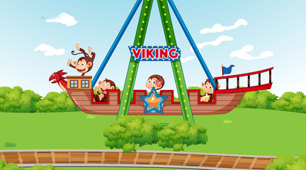 Happy monkeys riding on viking ship in the park