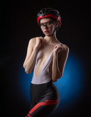 Obraz na płótnie Canvas girl cyclist sexy Nude in a helmet