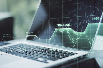 Multi exposure of creative statistics data hologram on laptop background, stats and analytics concept