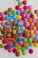 Background colorful many chocolate candy with colored glaze round candies