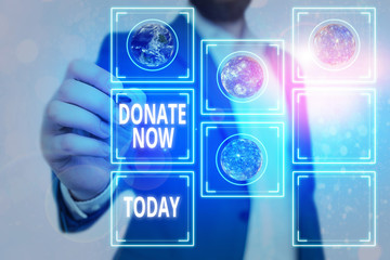 Handwriting text Donate Now. Conceptual photo to give something like money or goods to a charity or...