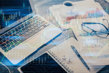 Double exposure of forex chart and work space with computer. Concept of international online trading.