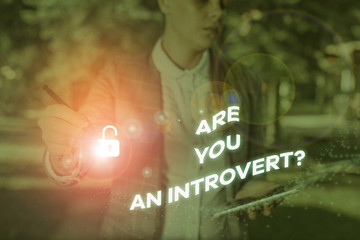 Writing note showing Are You An Introvertquestion. Business concept for demonstrating who tends to...