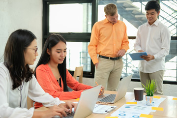 Fototapeta premium business people discussing on performance revenue in meeting. businessman working with businesswoman.