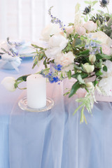 bouquet of flowers in a vase on wedding table