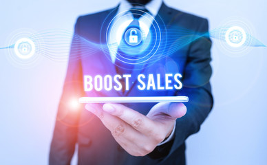 Conceptual hand writing showing Boost Sales. Concept meaning move sales profit from a lower to a...