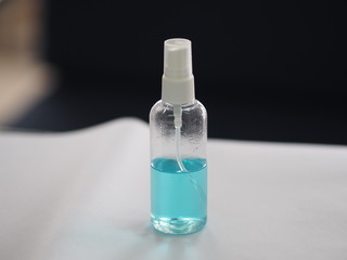 alcoholic 70 percent in clear Plastic bottle Spray, Hand Sanitizer on white table washing clean dirty to prevent germs protect colona virus, covid 19