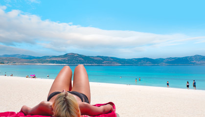Blondie girl relax on the beach of Salda Lake - Burdur, Turkey