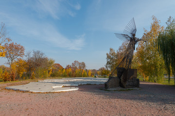 Memorial in Chernoby Exclusion Zone showing the evacuated communities and a sculptured angel of death playing the trumpet