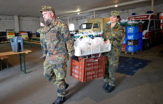 Soldiers of the German armed forces Bundeswehr prepare food supply for truck drivers trapped in a traffic jam on the highway A 4 near Goerlitz