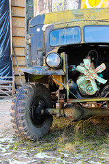 Steampunk bizarre auto with open engine. Creepy truck with rusted parts.