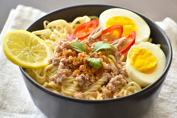 Instant noodles in a bowl. Selective focus. Tom Yum noodles. 