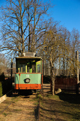 A vintage tram is out of service. Public transport stands at the depot. Old tram wagon.