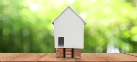 Obraz na płótnie Canvas House Model and coins . Housing Real Estate concept. home business idea
