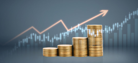 Graph stock market. Coins on stacks. investment and saving concept