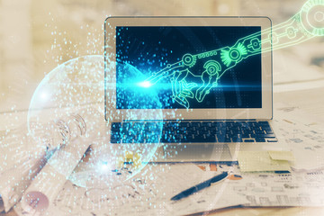 Double exposure of desktop computer and technology theme hologram. Concept of software development.