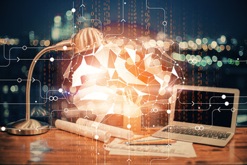 Multi exposure of work space with computer and human brain hologram. Brainstorm concept.