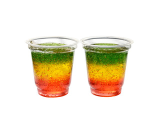Fototapeta na wymiar Multicolored jelly in cups isolated on a white background