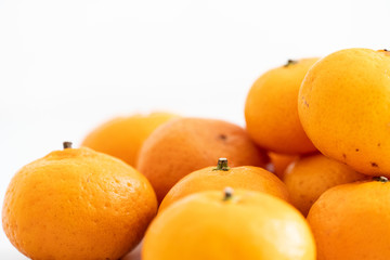 multiple orange on  white marble surface. Concept for fruit nutrition and diet food.