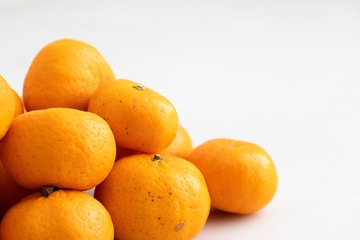 multiple orange on  white marble surface. Concept for fruit nutrition and diet food.