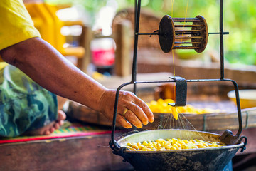 Crafts and craftsmanship. Silk raising for silk threads. yarn warping machine in a textile weaving...