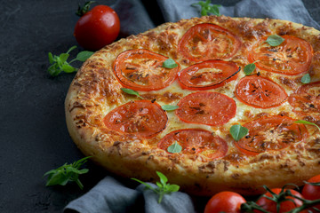 pizza Margarita on a dark background