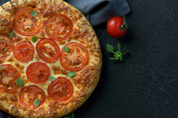 pizza Margarita on a dark background