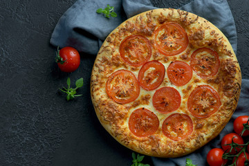 pizza Margarita on a dark background