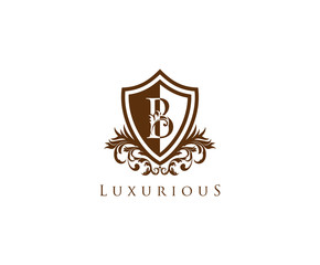 Fototapeta premium Vintage Letter B Logo. Shield B Letter Design Vector with shield shaper and Floral Hand Drawn.