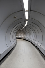 Fototapeta premium Curved walkway inside pedestrian crossing tunnel.