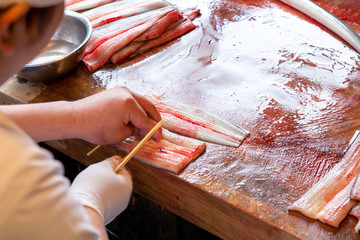 Japanese Chef sticking of eel and preparing for cooking. Chef prepare eel for grilling. Eel killing method and fillet fish for show and cooking Kabayaki or eel grill with sweet sauce.
