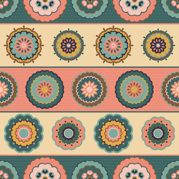 Seamless striped multicoloured pattern of retro flowers on a dark blue background. 