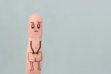 Finger art of sad man. Concept of impotence.